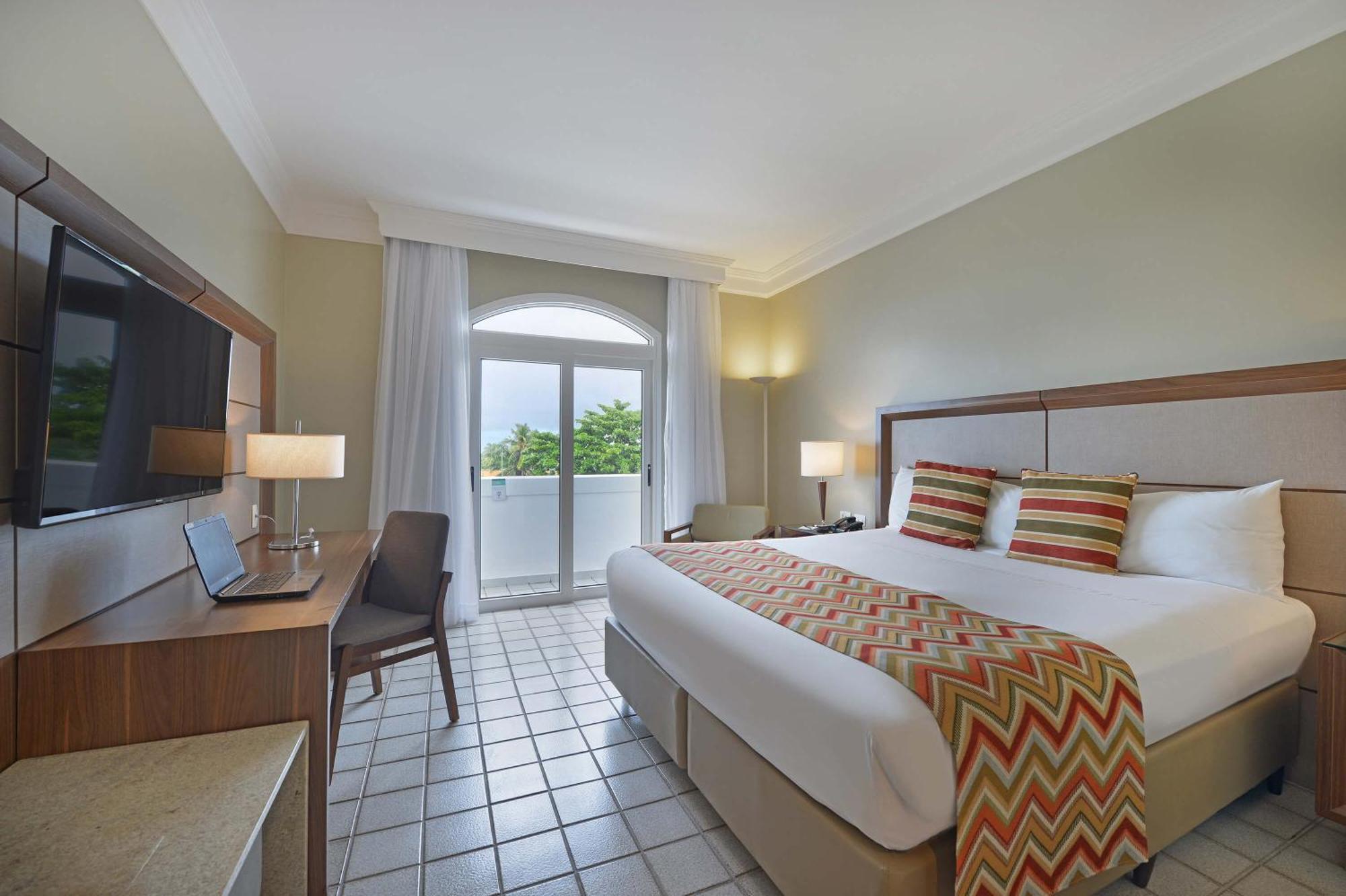 Hotel Deville Prime Salvador Exteriör bild A room at the hotel